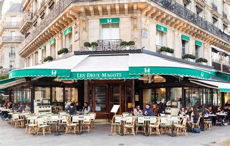 vintage bandw three friends at a paris cafe|famous cafes in paris france.